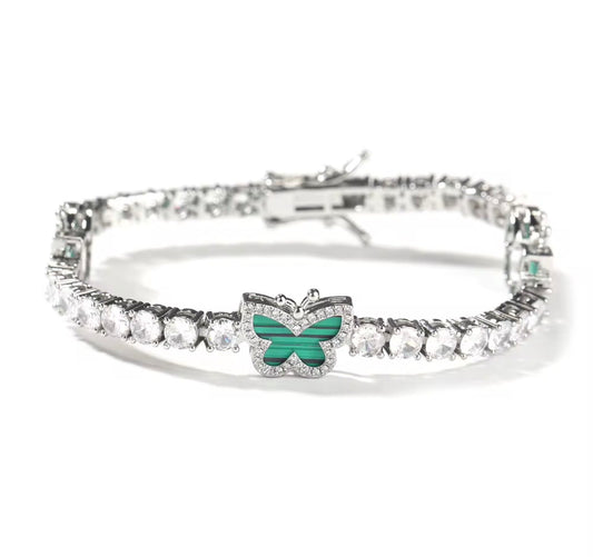 Sparkling diamond butterfly tennis bracelet featuring delicate butterfly charms and shimmering gemstones, elegant jewelry piece.