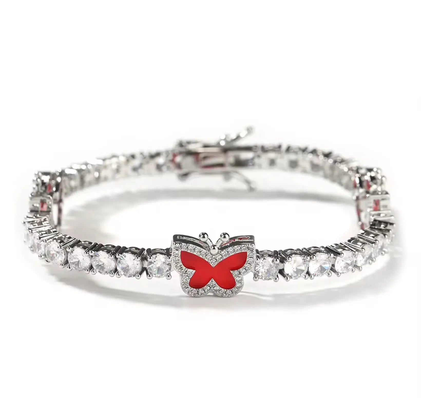 Diamond butterfly tennis bracelet by LuxeLash Studio featuring sparkling diamonds and delicate butterfly charms on a jewelry chain.