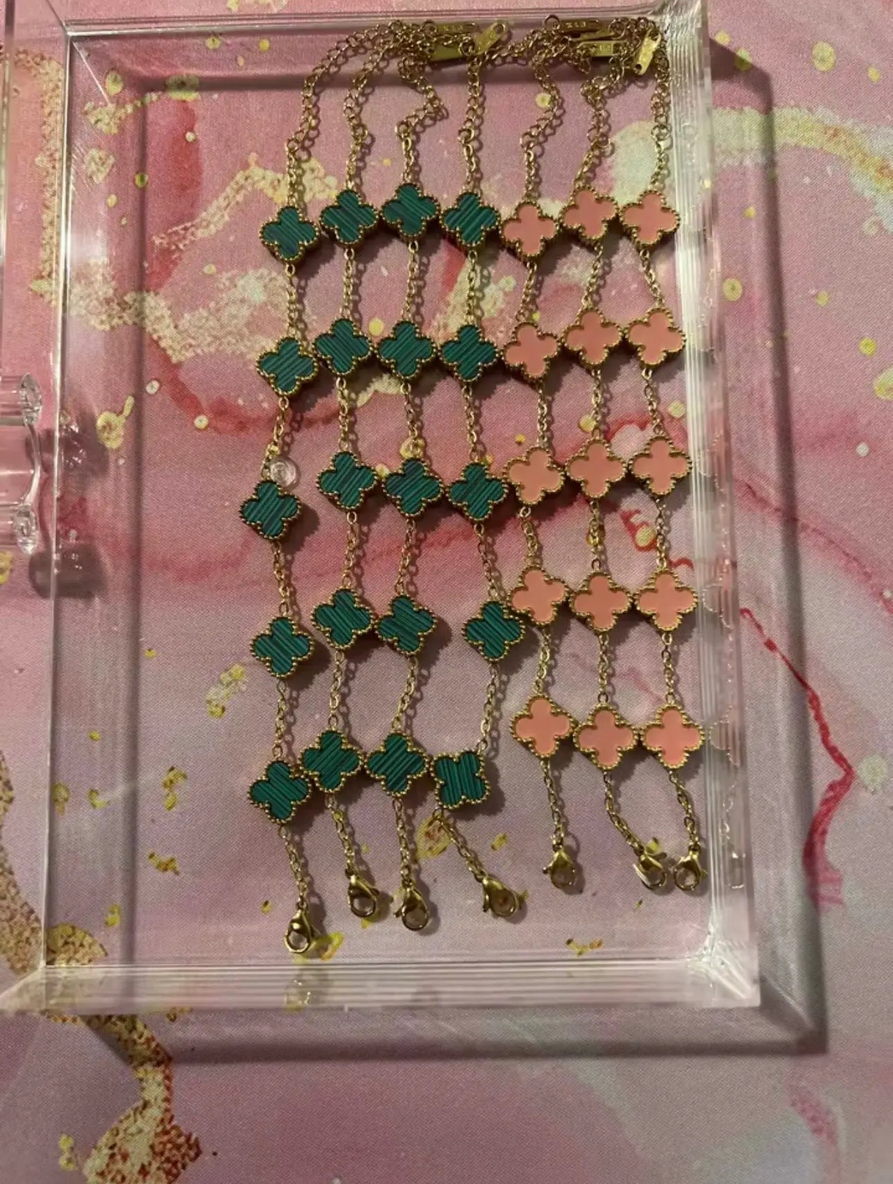 Gold Clover Charm Bracelet from LuxeLash Studio featuring delicate clover charms on a sleek gold chain.