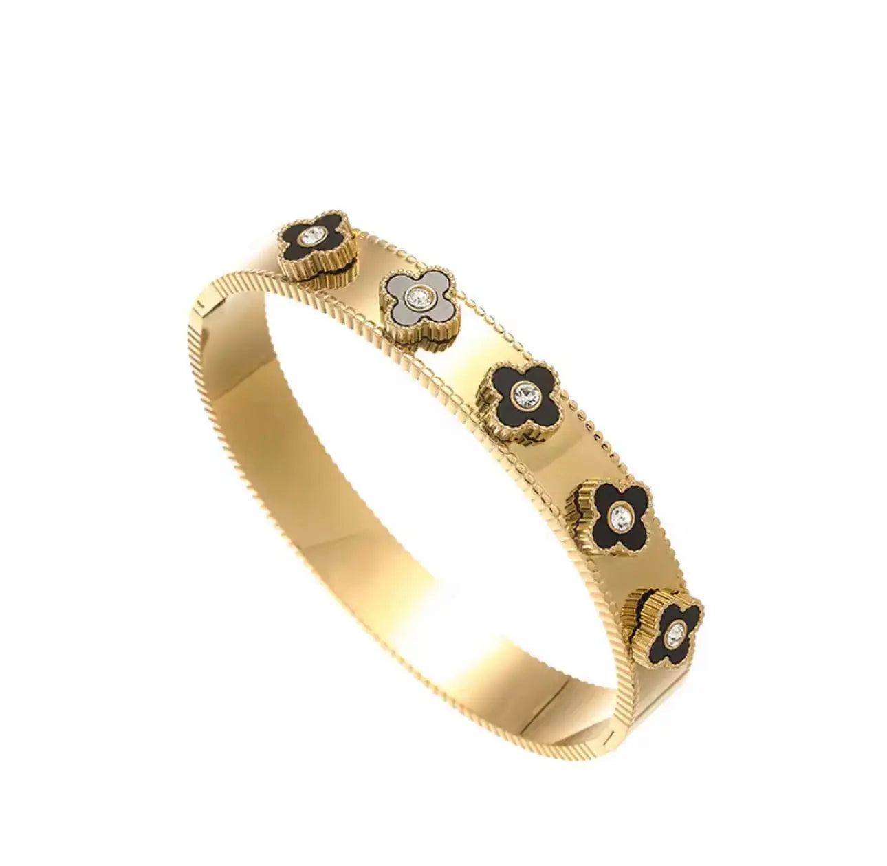 Elegant 18k gold flower bangle bracelet from LuxeLash Studio showcasing delicate floral design jewelry.