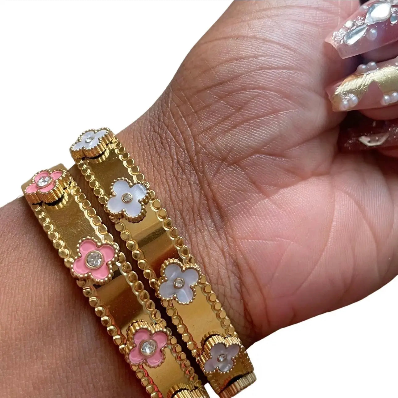 18k gold flower bangle bracelet from LuxeLash Studio featuring intricate floral design and polished finish, jewelry accessory.